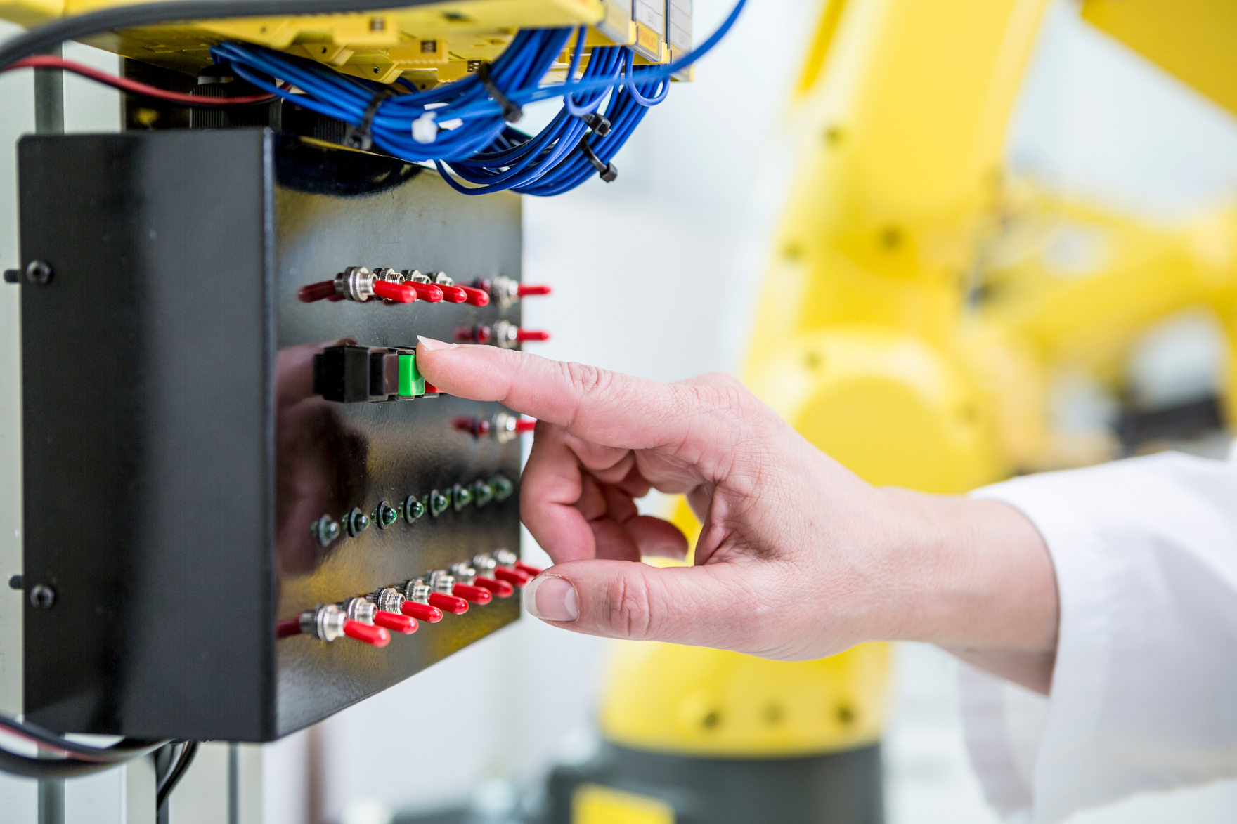 close-up-of-woman-switching-on-switch-in-factory-2026-03-09-05-46-22-utc