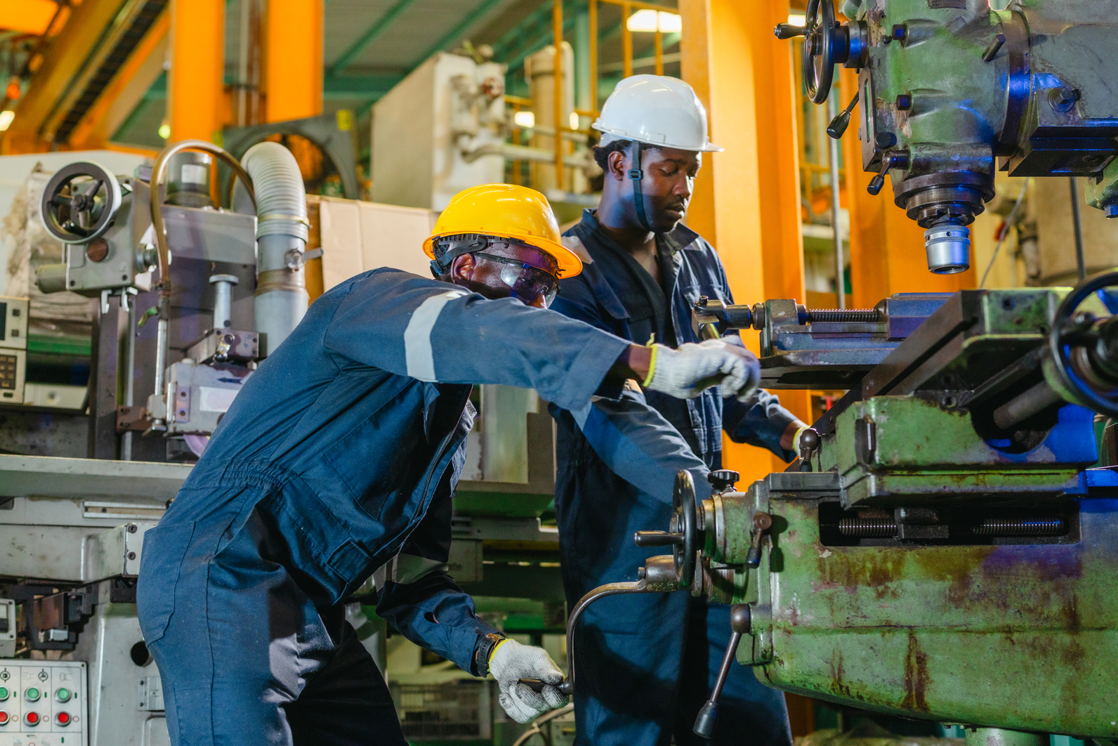 two-technicians-in-coveralls-and-hard-hats-operati-2026-07-01-23-34-32-utc