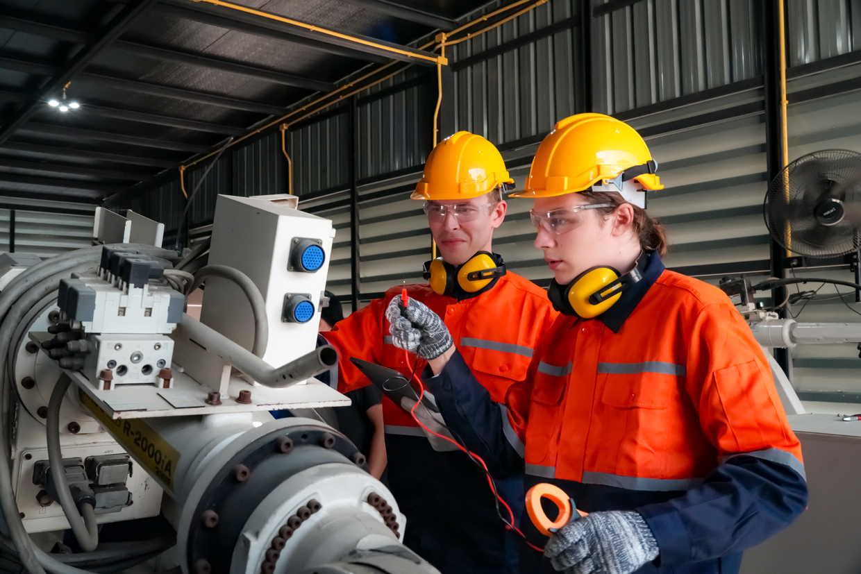 industrial-workers-inspecting-equipment-in-a-facto-2026-09-23-13-12-30-utc