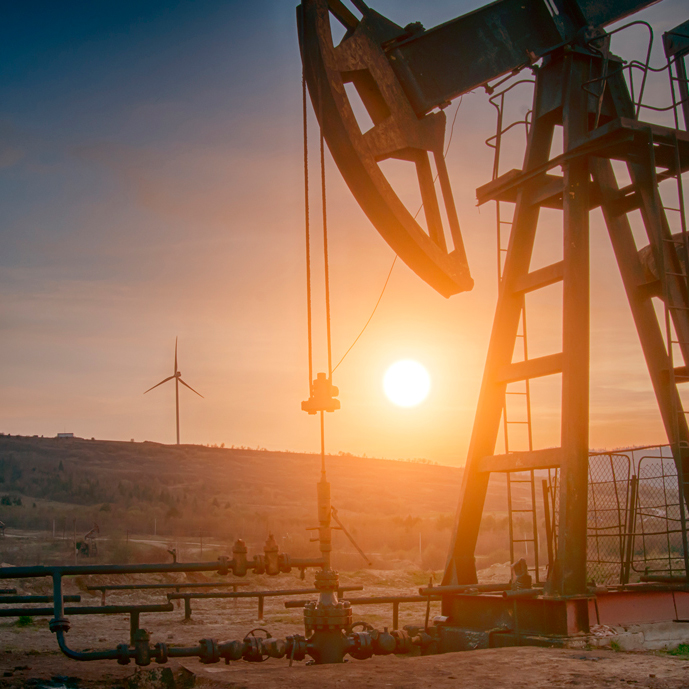 oil-pump-and-wind-turbines-at-sunset-2026-09-23-19-46-02-utc