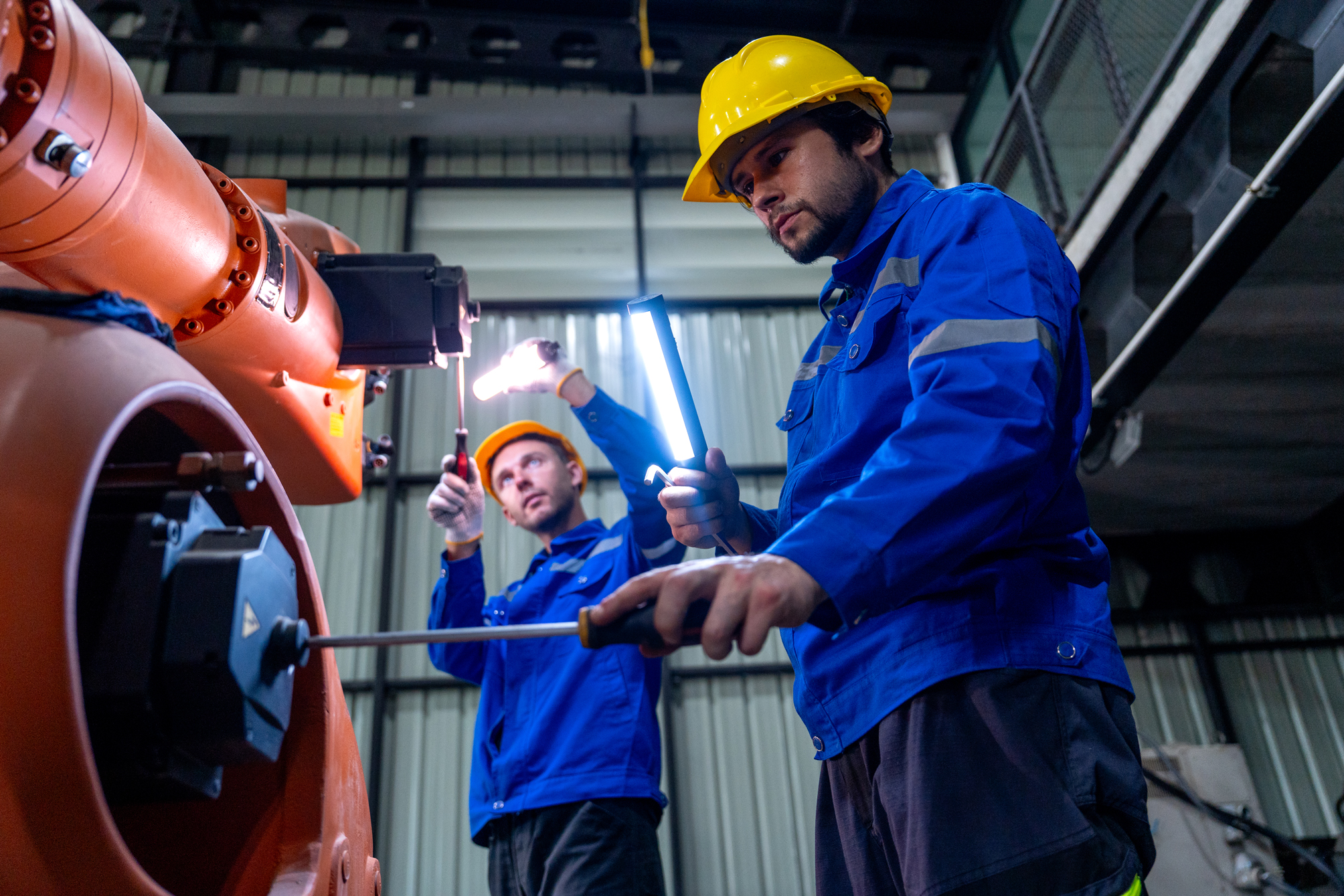 two-male-technicians-repairing-industrial-robotic-2026-08-28-02-29-59-utc