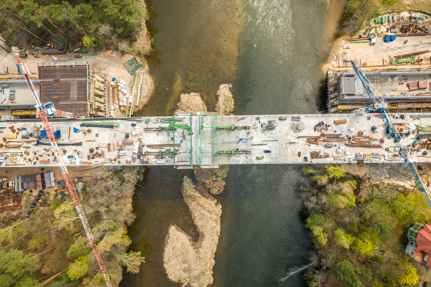 bridge-construction-over-river-with-cranes-2026-09-22-03-23-49-utc
