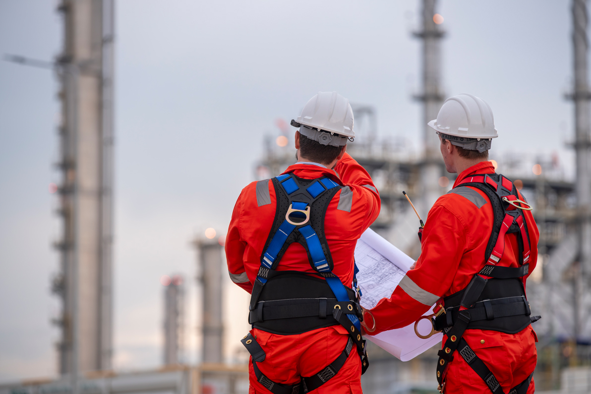 engineers-inspecting-refinery-plant-with-blueprint-2026-09-22-01-15-34-utc