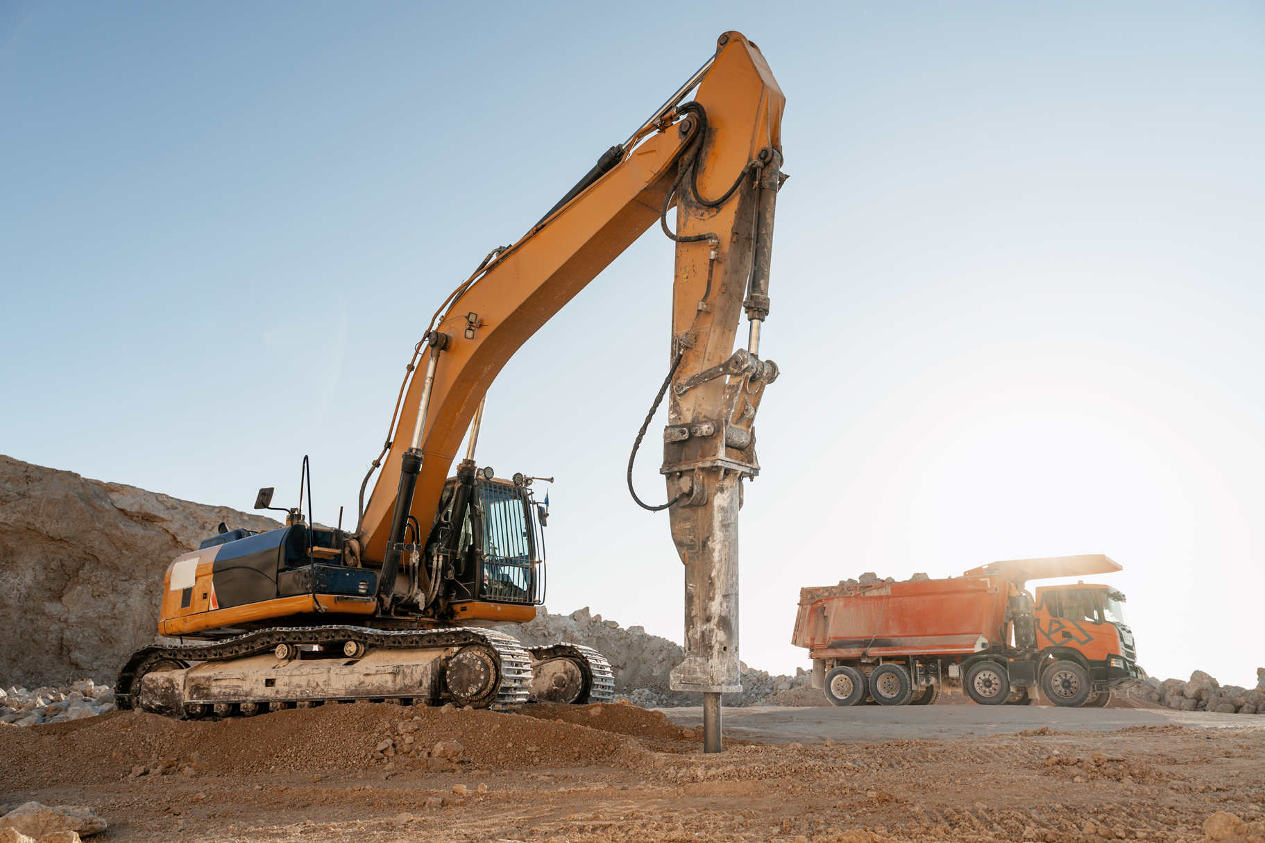 excavator-and-dump-truck-at-a-construction-site-2026-09-24-20-01-55-utc