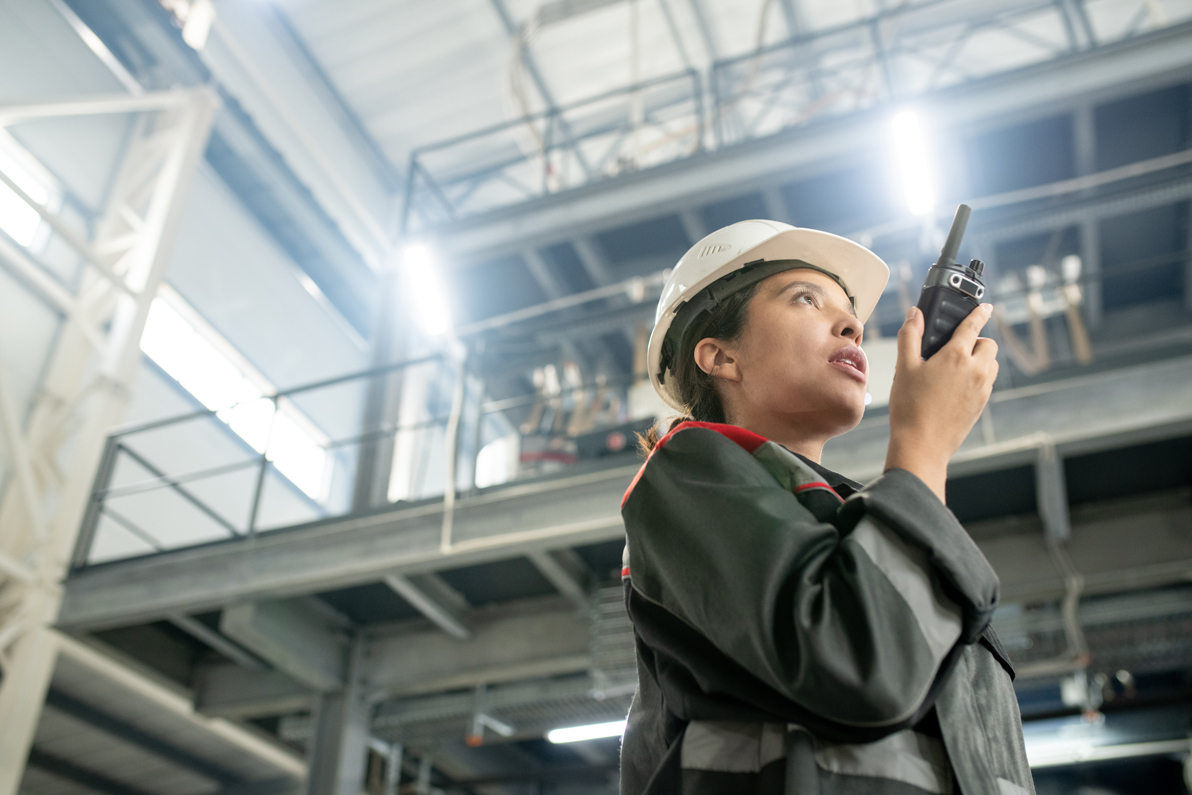 female-construction-worker-using-two-way-radio-ind-2026-09-24-04-27-02-utc