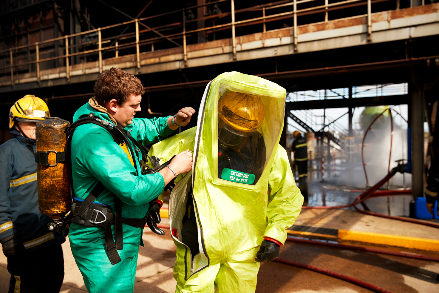 firemen-putting-on-fire-proximity-suit-in-training-2026-09-22-06-29-23-utc