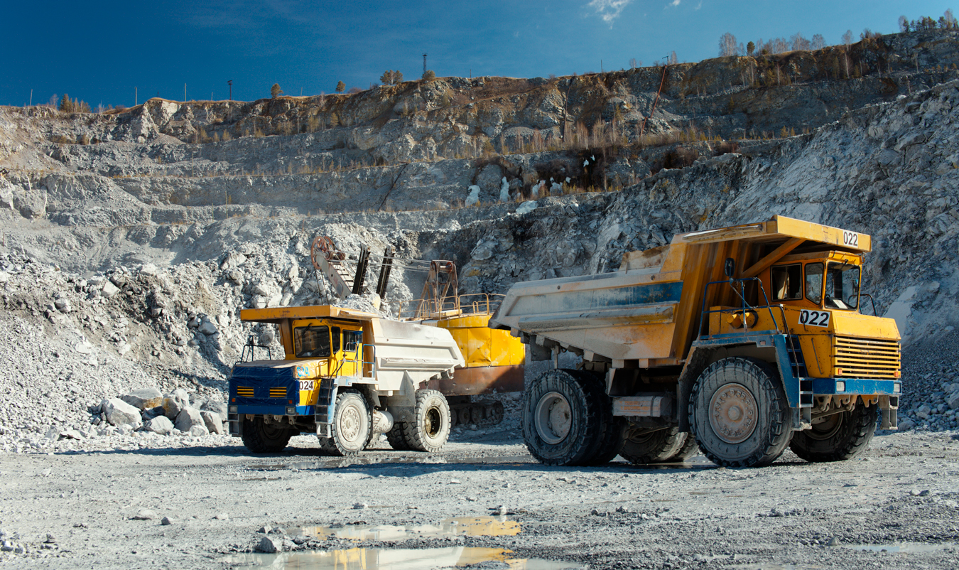 massive-mining-trucks-at-open-pit-mine-2026-09-22-10-08-40-utc-(1)